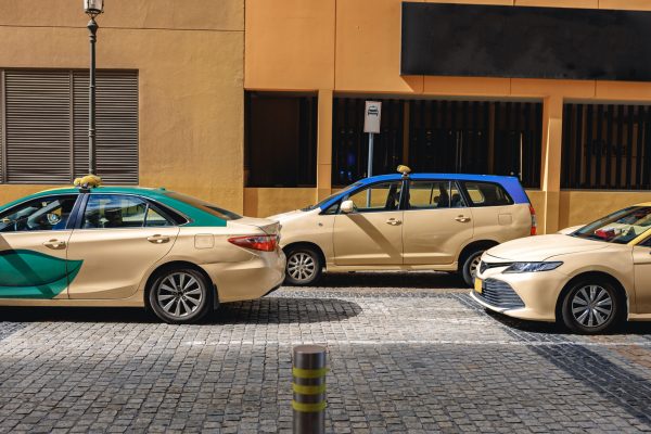 Taxi car parked at downtown in Dubai city. United Arab Emirates